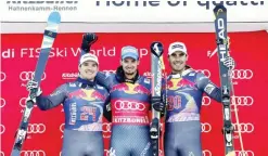  ??  ?? KITZBUEHEL: Italy’s Dominik Paris, center, winner of an alpine ski, men’s World Cup downhill, poses on the podium with second placed France’s Valentin Giraud Moine, left, and third placed France’s Johan Clarey, in Kitzbuehel, Austria, yesterday. — AP