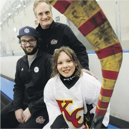  ?? DAVID BLOOM ?? Joseph Gardiner, 10, sits with his mentors John Putters, top, and Elliott Putters at the Terwillega­r Arena on Sunday. John Putters has helped Joseph live his dream to lace up the skates.