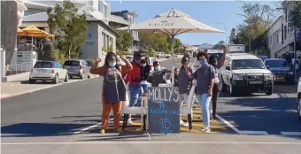  ??  ?? Several restaurant­s in Plettenber­g Bay dragged their tables and chairs out into Main Street in solidarity with the nationwide peaceful protest action.