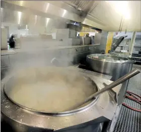  ?? Arkansas Democrat-Gazette/JOHN SYKES JR. ?? Chicken soup boils in a vat at the CareLink facility in North Little Rock. The facility serves 1,200 meals per day, although it is equipped to make 2,000.