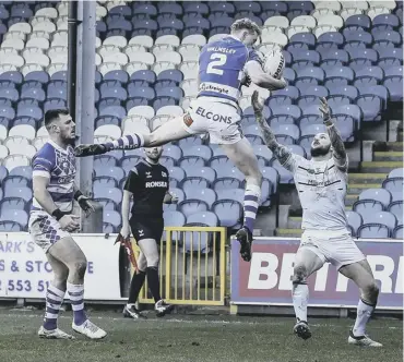  ?? ?? HIGH TIMES: Lachlan Walmsley out-jumps Luke Briscoe to score for Fax. Pictures: Simon Hall