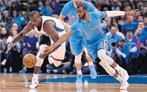  ?? EPA ?? The Thunder’s Serge Ibaka, left, vies with the Clippers’ Chris Paul.