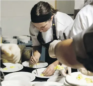  ??  ?? Chef Davina Moraiko works on a dish at the Great Canadian Kitchen Party culinary contest at the Shaw Conference Centre Wednesday night.