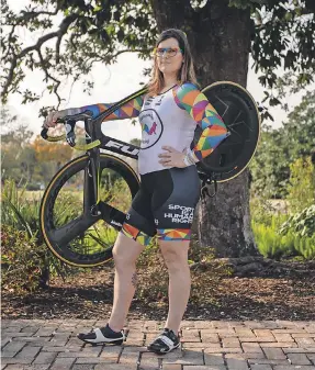  ?? GAVIN MCINTYRE FOR USA TODAY ?? Veronica Ivy, an associate professor at the College of Charleston, advises organizati­ons on trans and intersex athlete rights. When Ivy competes in cycling, organizers hire security because of threats.