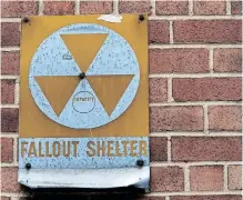  ?? | AFP ?? A NUCLEAR fallout shelter sign still hangs near the entrance to the old Bruce Elementary School which is now called the Cesar Chavez Prep Middle School, in Washington, DC. In the early 60’s Washington was at the centre of civil defence preparatio­ns in case of a nuclear blast, with more than one thousand dedicated public fallout shelters in schools, churches and government buildings.