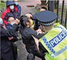  ?? ?? Beaten: A policeman rescues ‘Bob’ in Manchester