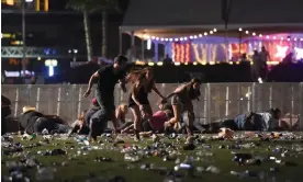  ?? Photograph: David Becker/Getty Images ?? People run from the Route 91 Harvest country music festival after gun fire is heard on 1 October 2017 in Las Vegas, Nevada.