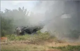  ?? Efrem Lukatsky Associated Press ?? UKRAINIAN soldiers fire a U.S.-supplied M777 howitzer against Russian positions in the Donetsk region. Fighting remains intense in eastern Ukraine.