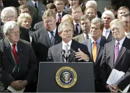  ?? RON EDMONDS — THE ASSOCIATED PRESS FILE ?? President George W. Bush announces Oct. 2, 2022, at the White House Rose Garden in Washington that he has reached an agreement with House leaders on a resolution giving him authority to oust Iraq's Saddam Hussein. Bush is joined by, from left front row, Speaker of the House Dennis Hastert, R-Ill, Sen. Trent Lott, R-Miss., and House Minority Leader Dick Gephardt, D-Mo.