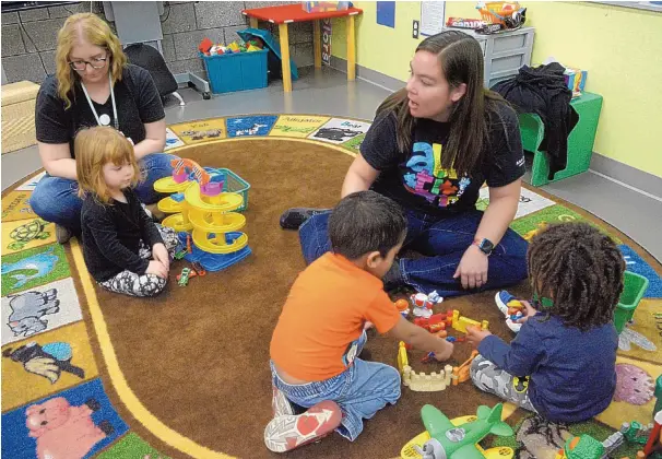  ?? GREG SORBER/JOURNAL ?? Educationa­l assistant Nicole Mahan, left, and teacher Jessica Bohnhoff help pre-k students at the Aztec Special Education Support Complex in January 2019.