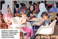  ??  ?? Asylum seekers from Pakistan, Afghanista­n and Iran stay inside Negombo police station for safety