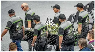  ?? PHOTOS: WARWICK SMITH ?? Pallbearer­s carry Stephen Penn into the Arena.