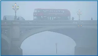  ?? Pictures: STEVE PARSONS, YUI MOK/PA, GUY CORBISHLEY, RICHARD CAVE ?? A bus crossing Westminste­r Bridge in London where pupils were kept indoors