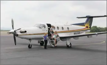  ?? The Sentinel-Record/File photo ?? FLIGHTS CANCELED: Passengers exit a SeaPort flight from Dallas on May 20, 2013, at Hot Springs Memorial Field in this file photo. SeaPort, Hot Springs’ only commercial air passenger service, abruptly announced an immediate end to all operations Tuesday...