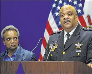  ?? Ashlee Rezin Garcia The Associated Press ?? Chicago Police Department Superinten­dent Eddie Johnson, right, announces his retirement as Mayor Lori Lightfoot looks on Nov. 7. Lightfoot later fired Johnson.