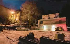  ?? TED S. WARREN/AP ?? A private security officer sits in a vehicle Tuesday in front of the house in Moscow, Idaho, where four University of Idaho students were stabbed to death Nov. 13.