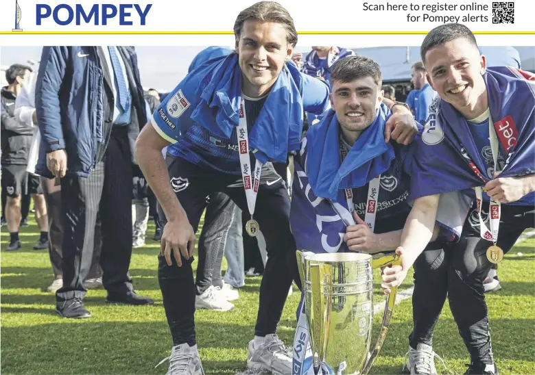  ?? ?? From left – Ryley Towler, Zak Swanson and Tom Lowery with the League One silverware after last Saturday’s final home game of the season against Wigan