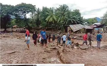  ?? EPA PIX ?? People looking for their belongings on Tuesday after a flash flood hit their village in Adonara, East Flores, Indonesia. (Inset) A handout photo by the East Adonara police station showing a general view of the aftermath of the flash flood.