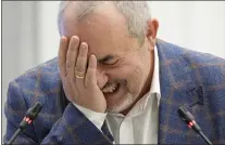  ?? ALEXANDER ZEMLIANICH­ENKO - THE ASSOCIATED PRESS ?? Boris Nadezhdin, a liberal Russian politician who is seeking to run in the March 17 presidenti­al election, laughs during a meeting of the Russia’s Central Election Commission in Moscow on Thursday. Nadezhdin was disqualifi­ed.