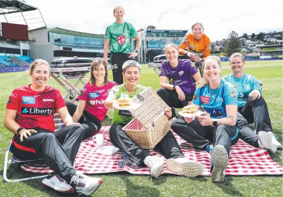  ?? ?? Georgia Wareham, Ellyse Perry, Issy Wong, Tayla Vlaeminck, Amanda-Jade Wellington and Jess Jonassen and (back) Meg Lanning and Beth Mooney at Blundstone Arena ahead of the start of the 2021 WBBL season. BELOW: National team teammates Perry and Lanning. Pictures: Sarah Reed/Getty