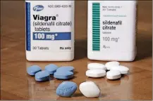  ?? AP PHOTO/RICHARD DREW ?? Pfizer’s Viagra, left, and the company’s generic version, sildenafil citrate, at Pfizer Inc. headquarte­rs in New York Dec. 4. The drugmaker is launching its own cheaper generic version of Viagra rather than lose sales when its impotence pill gets its...