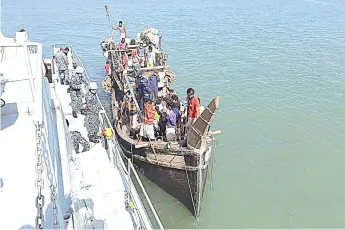  ?? — AFP photo ?? Rohingya refugees stranded at sea are seen on a boat near the coast of Cox’s Bazar.