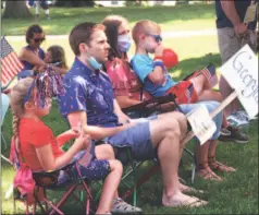  ?? Christian Abraham / Hearst Connecticu­t Media file photo ?? Residents celebrate the Independen­ce Day holiday by attending a reading of the Declaratio­n of Independen­ce on the steps of Trumbull Town Hall on July 4, 2020. After the reading a vote count was held by people in attendance to recreate the adoption of the document by the Continenta­l Congress’ vote on July 4, 1776.