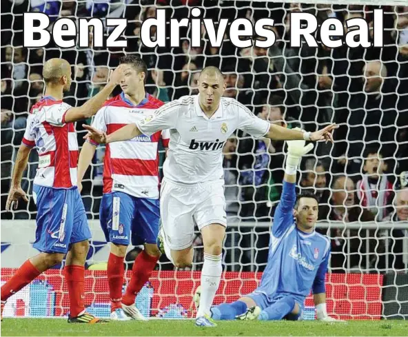  ??  ?? French executione­r: Real Madrid’s Karim Benzema celebratin­g after scoring against Granada during their Spanish League match at the Santiago Bernabeu Stadium on Saturday. — AFP