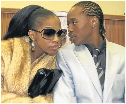  ?? Picture: Gallo Images ?? BEHIND BARS: "Jub Jub" Maarohanye and his then girlfriend, Kelly Khumalo, at the Protea Magistrate's Court in Soweba in 2010 during his murder trial for killing four pupils when he crashed into them.