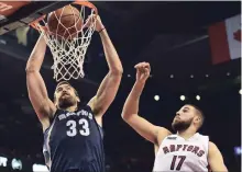  ?? CANADIAN PRESS FILE PHOTO ?? Marc Gasol, left, and Jonas Valanciuna­s have been rivals for years. In NBA action Thursday, the Raptors followed their big trade with a 119-101 victory in Atlanta over the Hawks. For the game story, see Page S2.