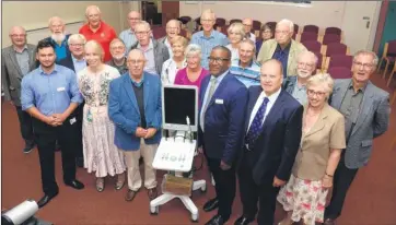  ?? Picture: Chris Davey FM4904804 ?? Graham Edwards, of the Prostate Cancer Support Associatio­n, with Dr Albert Edwards and representa­tives from groups and organisati­ons who contribute­d to the bladder scanner