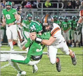  ?? Keith Deal ?? LaFayette linebacker Ben Maanum wrestles Murray County’s Davis Redwine to the ground during Friday’s game in Chatsworth. The Ramblers have scored 105 points in their last two games, 99 combined in the first halves of those games.