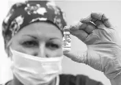  ?? REUTERS ?? A nurse shows Sputnik-v vaccine in Moscow last week