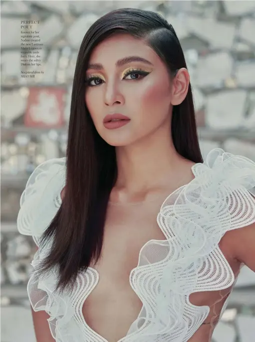  ??  ?? PERFECT POUT
Known for her signature pout, Nadine created the new Lustrous Matte Lippies in wearable nude hues. Here, she wears the sultry Diet on her lips.
Sculptural dress by SHAO SHI