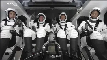  ?? SPACEX VIA AP ?? This photo provided by SpaceX shows the SpaceX crew seated in the Dragon spacecraft on Friday in Cape Canaveral, Fla. SpaceX launched three rich businessme­n and their astronaut escort to the Internatio­nal Space Station.