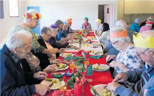  ??  ?? Some of the 40 elderly Norsewood citizens enjoying Christmas lunch served by Lions including vice-president Birgitta Rolston.