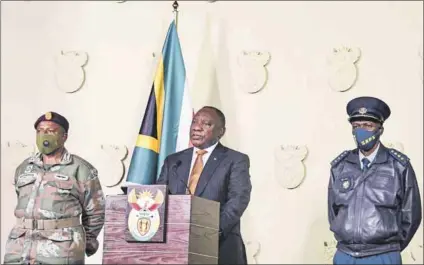  ?? Photo: GCIS ?? Absolute power? President Cyril Ramaphosa (centre) announced last month that the department of state security will be moved into the presidency.