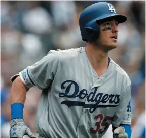  ?? AP FILE PHOTO ?? Los Angeles Dodgers player Cody Bellinger watches his solo home run during a game against the San Diego Padres in San Diego on Sept. 3. The Dodgers will pay the highest luxury tax in the league for the fourth time in a row.