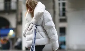  ?? Berthelot/Getty Images ?? A white puffer coat with fur during Paris fashion week in 2017. Photograph: Edward