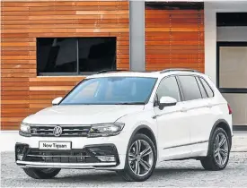  ??  ?? The Tiguan looks at its best when wearing a R-Line kit, above. The comfortabl­e interior, left, is superb, with lots of space.