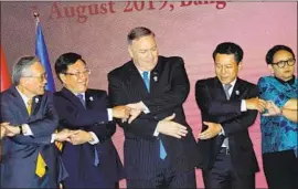  ?? Jonathan Ernst Pool Photo ?? SECRETARY of State Michael R. Pompeo is flanked by, from far left, counterpar­ts from Thailand, Vietnam, Laos and Indonesia at a regional conference.