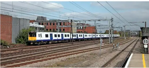  ?? ANTONY GUPPY. ?? MTR Crossrail 315857 and 315824 pass Romford on October 12 2015, with the 1350 Ilford-Gidea Park empty coaching stock. The need to carry out infrastruc­ture work at this train’s start and destinatio­n meant the operator needed additional facilities, and...