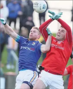  ??  ?? Longford’s Shane Donohoe goes up against Louth’s Andy McDonnell.