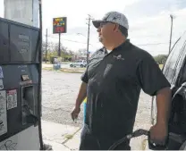  ?? Jerry Lara / Staff photograph­er ?? Fabien Soto, 39, gasses up at MLK Food Mart. According to GasBuddy, the average price for regular is $2.05 in San Antonio.