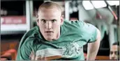  ?? WARNER BROS. PICTURES ?? Spencer Stone, playing himself, dashes up the train aisle toward a terrorist in Clint Eastwood’s “The 15:17 to Paris.”