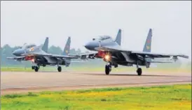  ?? AP FILE ?? Two Chinese SU30 fighter jets take off from an unspecifie­d location.