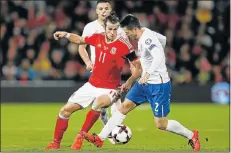  ?? Picture: REUTERS ?? FIERCE BATTLE: Wales’s Gareth Bale and Serbia’s Antonio Rukavina during their World Cup qualifying match at the Cardiff City Stadium in Wales. Wales are now third in Group D with six points