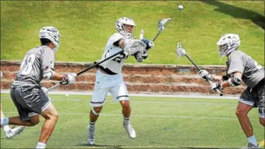  ?? GENE WALSH — DIGITAL FIRST MEDIA ?? La Salle’s Christophe­r Mockaitis takes a shot on goal during the Explorers’ PIAA-3A semifinal against Conestoga Tuesday.