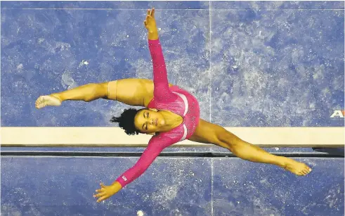  ?? NHATV. MEYER/STAFF ?? Laurie Hernandez, 16, shown on the balance beam during the Olympic trials, is the first Latina gymnast since Annia Hatch in 2004 to make the U.S. Olympic team.