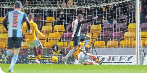  ??  ?? Simeon Jackson follows up Cammy Smith’s shot and smashes home from close range to give St Mirren the winner at Fir Park